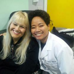 Dr. Emily Letran with a satisfied patient